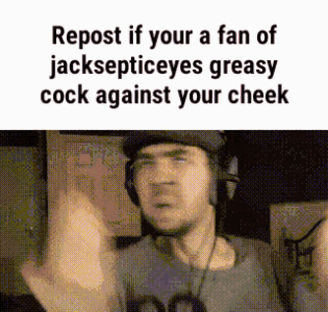 a man wearing headphones is making a funny face while giving the middle finger .