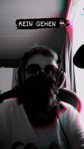 a person wearing headphones and sunglasses has a sign that says rein gehen above them
