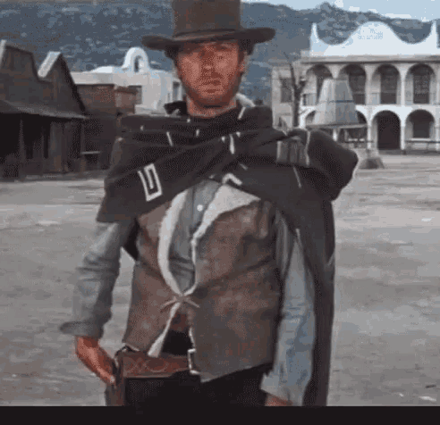Clint Eastwood Who Are You GIF - Clint Eastwood Who Are You A Fistful Of Dollars GIFs