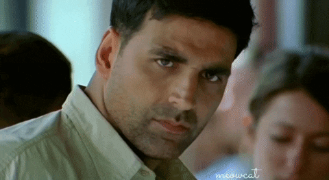 a close up of a man 's face with the words meowcat written on the bottom