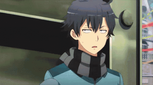 a man with a scarf around his neck is making a funny face with his eyes closed