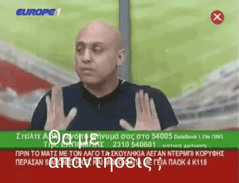 a man is talking on a television screen with a red x on the bottom right