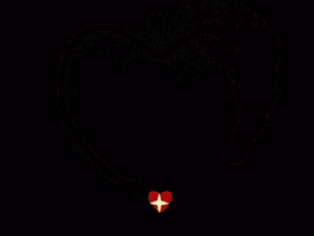 a red heart with sparkles coming out of it on a black background