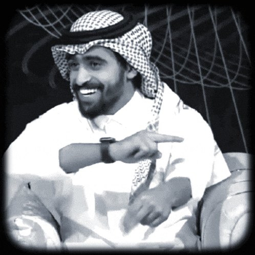 a black and white photo of a man in a turban