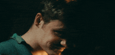 a man and a woman are looking into each others eyes
