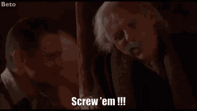 a man with long hair is smiling and says screw ' em !!!