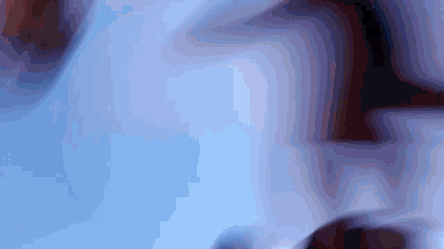 a close up of a person 's face with a blurred background