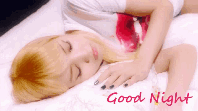 a woman is sleeping on a bed with the words " good night " written above her