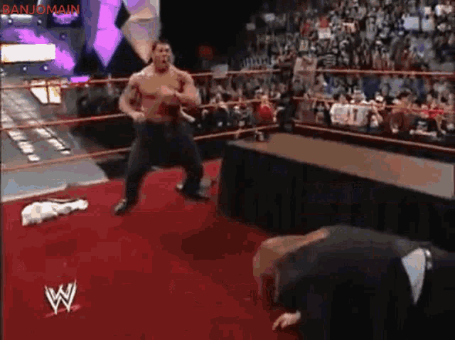 Batista Bomb Triple H Through A Table GIF - Batista Bomb Triple H Through A Table GIFs
