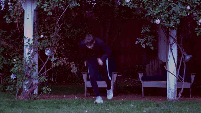 a blurry picture of a man kicking a ball