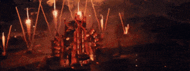 a man and a woman are watching fireworks in the sky