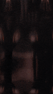 a dark room with a circular object in the center
