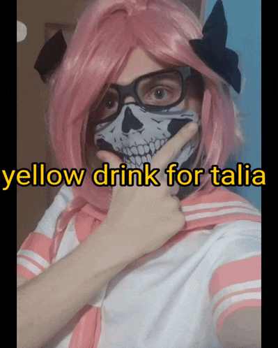 a person wearing a pink wig and a skull mask with the words yellow drink for talia below them