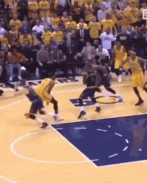 a basketball game is being played on a court with a sign that says ' nba ' on it