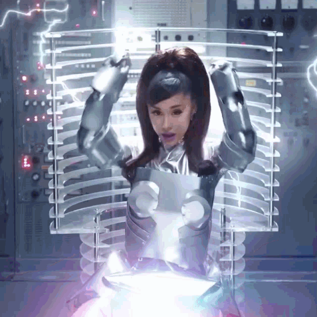 a woman in a robot costume is standing in front of a machine
