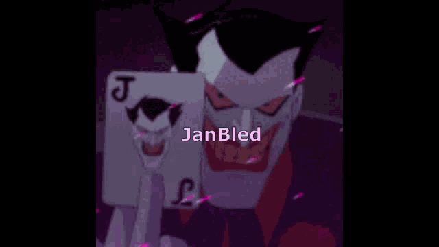 the joker is holding a playing card with the letter j on it 's face