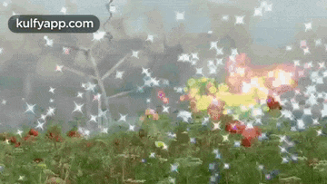 a field of flowers with a windmill in the background
