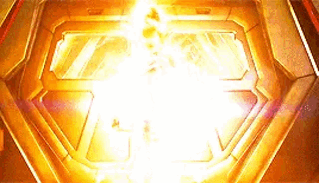 a person is standing in a room with a lot of lights coming out of the ceiling .