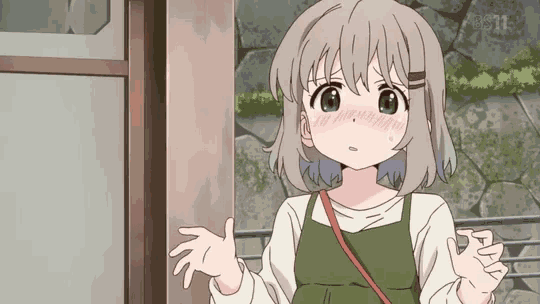 a girl with gray hair and green eyes is standing in front of a stone wall .