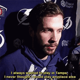 a man talking into a microphone with the words i always wanted to play in tampa on the bottom