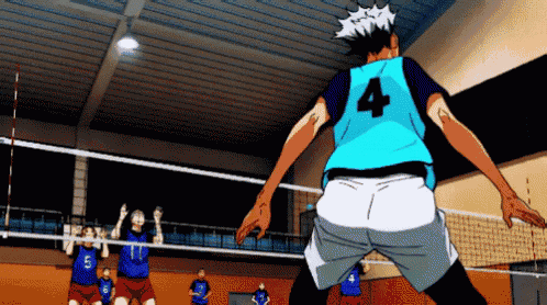 a volleyball player with the number 4 on his back is jumping in the air