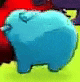 a blue piggy bank is sitting on a green surface next to a red piggy bank .