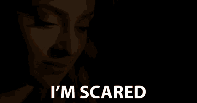 a close up of a woman 's face with the words " i 'm scared " below her