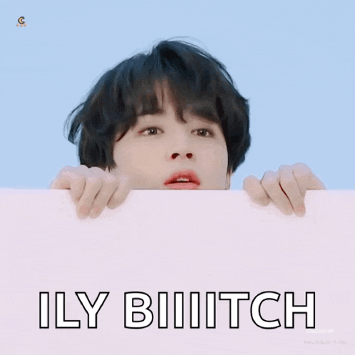 a person holding a sign that says ily biiitch on it