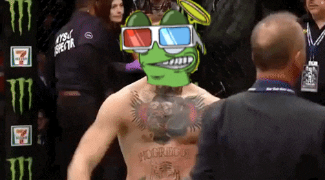 a man wearing 3d glasses stands in front of a monster energy sign