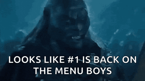 a close up of a man 's face with the words `` looks like # 1 is back on the menu boys '' below it .