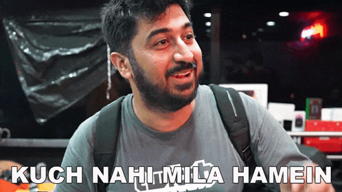 a man with a beard is wearing a t-shirt that says kuch nahi mila hamein