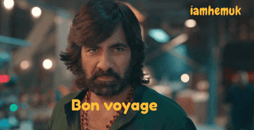 a man with a beard and the words bon voyage on the bottom right