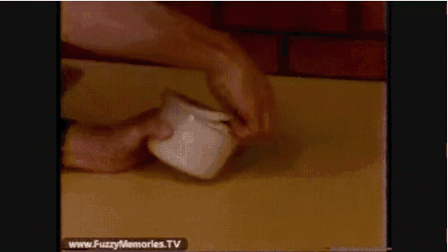 a video of a person holding a cup with the website www.fuzzymemories.tv displayed