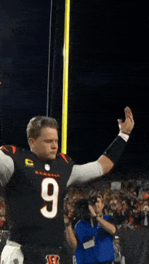 a man in a bengals jersey with the number 9