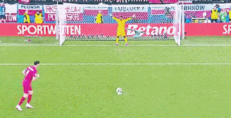 a soccer player with the number 9 on his jersey runs towards the goal