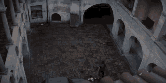 a person in a falcon costume is flying through a building