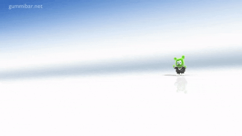 a green gummy bear is standing in front of a blue sky