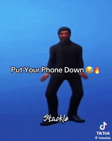 a man in a suit is dancing with the words put your phone down