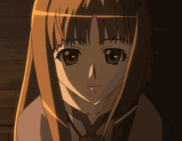 a close up of a girl 's face with brown hair