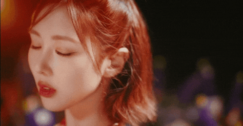a close up of a woman with red hair