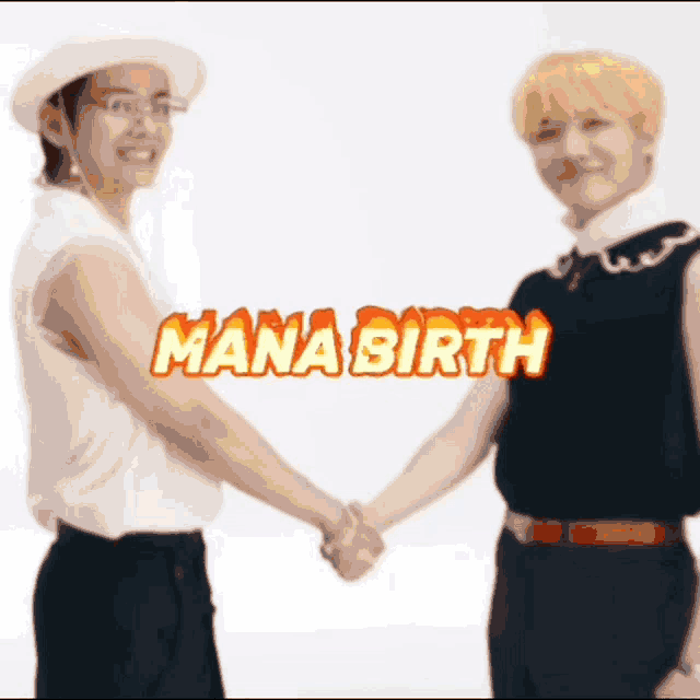 two men shaking hands in front of a sign that says mana birth .