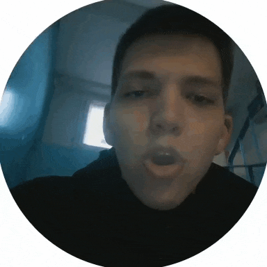 a close up of a man 's face with his mouth open