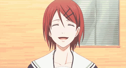 a girl with red hair is giving a thumbs down