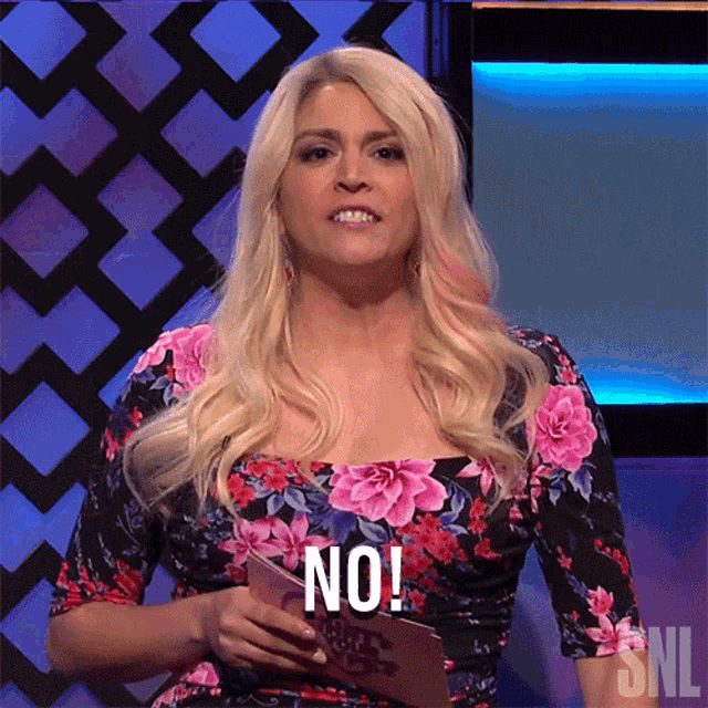 a blonde woman in a floral dress is holding a snl sign