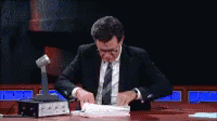 Looking Thru The Reciepts GIF - Evidence List Stephen Colbert GIFs