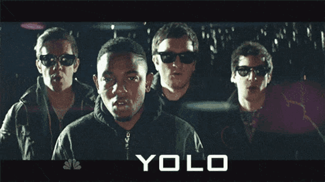 a group of men are standing next to each other with the word yolo on the bottom right