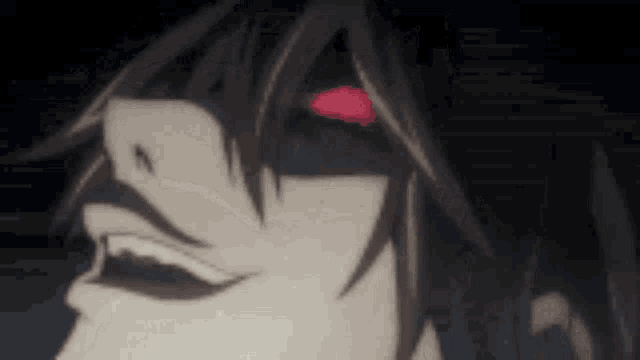 a close up of a person 's face with a red spot on their forehead