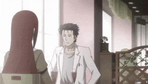 a man and a woman are standing next to each other in a room .