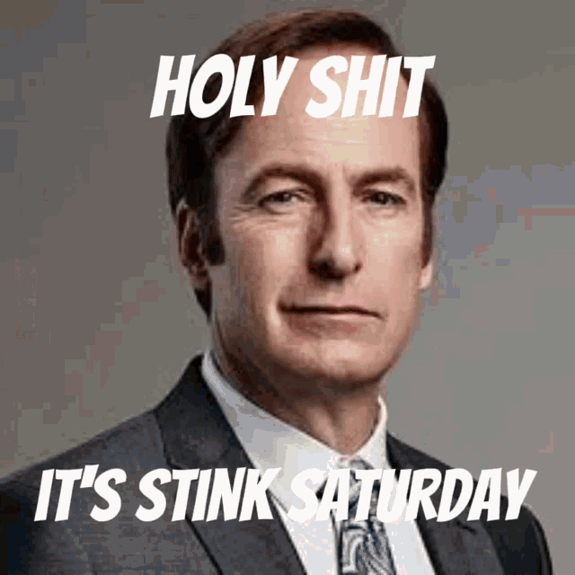 a man in a suit and tie with the words holy shit it 's stink saturday