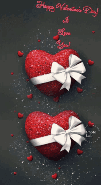 a happy valentine 's day greeting card with two red hearts with white bows